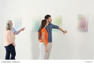 People looking at picture in art gallery